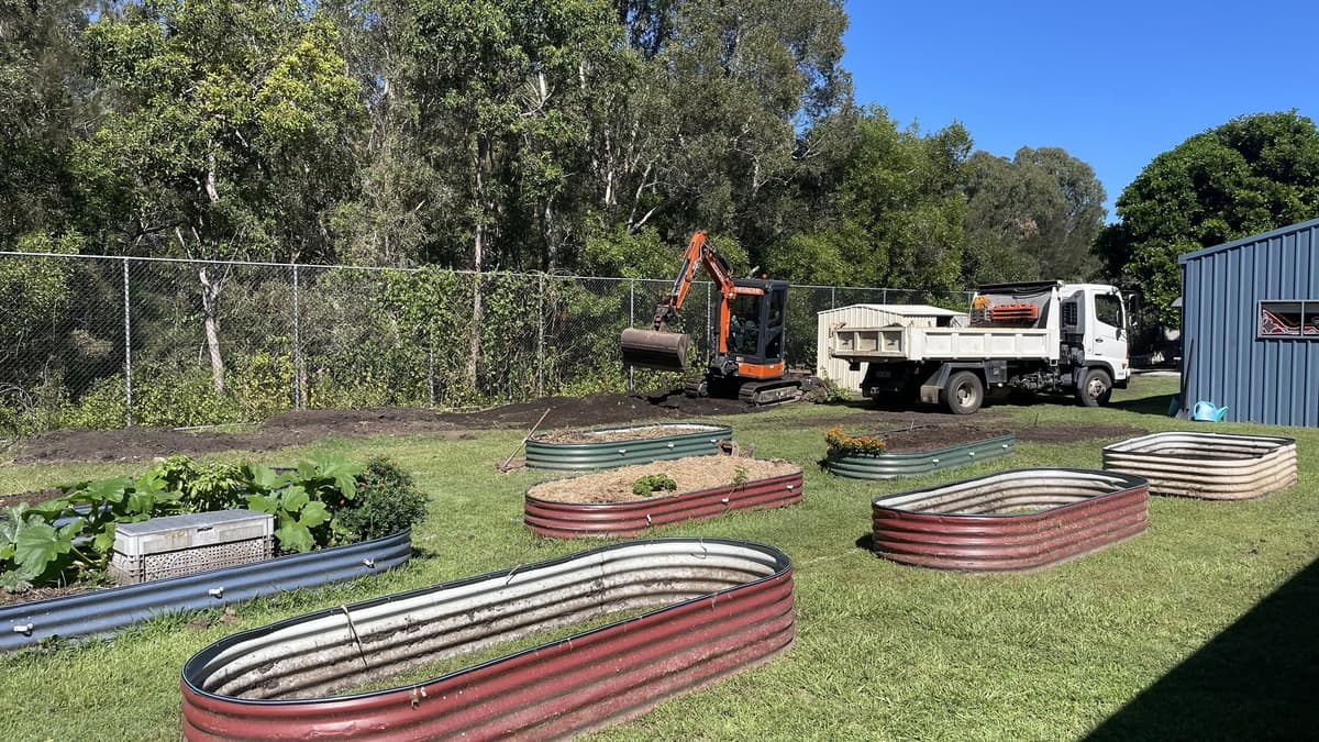 New raised steel garden beds set out on the lawn