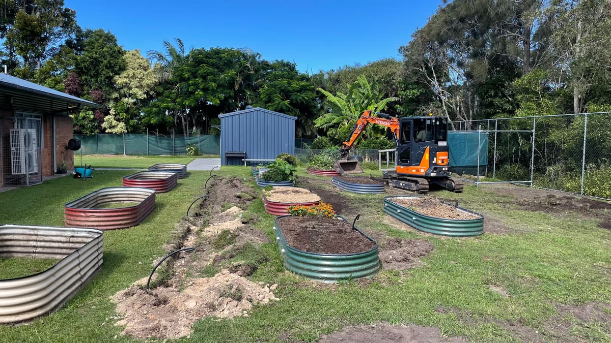 Raised beds being installed and filled on site